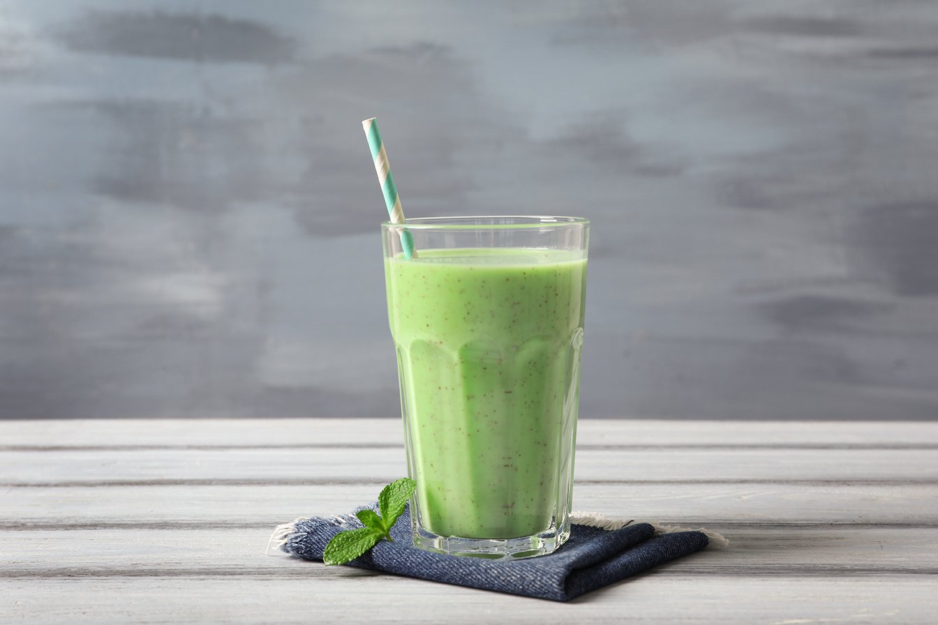 Glass with Green Milkshake on Table